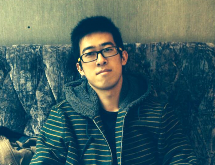 Zhen Wang sitting on a couch