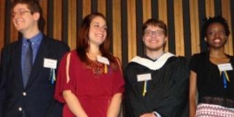 Group of four students at an awards ceremony